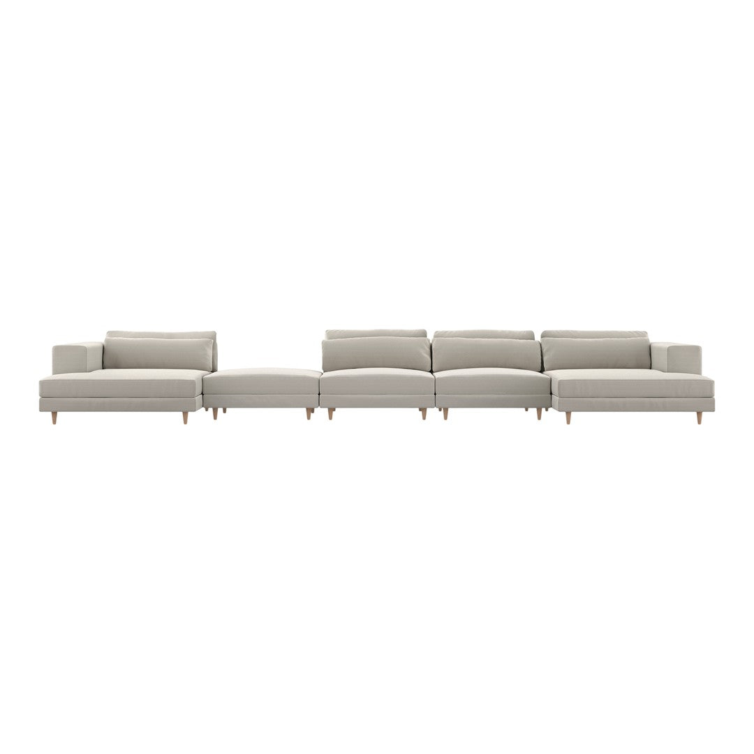 Light gray sectional sofa with clean lines and subtle tufted texture, featuring natural wood legs for a modern look.