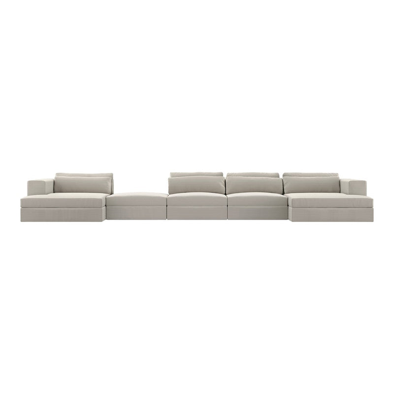 Light gray modular sofa with a smooth, modern design, featuring clean lines and no visible patterns.