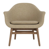 Beige upholstered chair with a smooth, rounded design and wooden legs, perfect for modern decor.