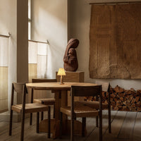 "Warm wood tones with neutral beige accents and textured natural fabrics, creating a cozy and inviting atmosphere."