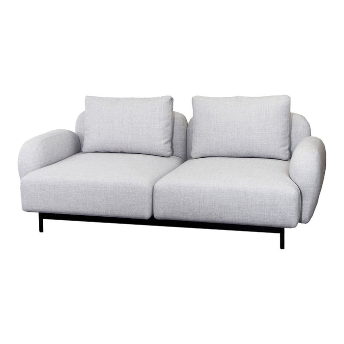 Light gray fabric sofa with a smooth texture and curved cushions, featuring a minimalist black metal frame.