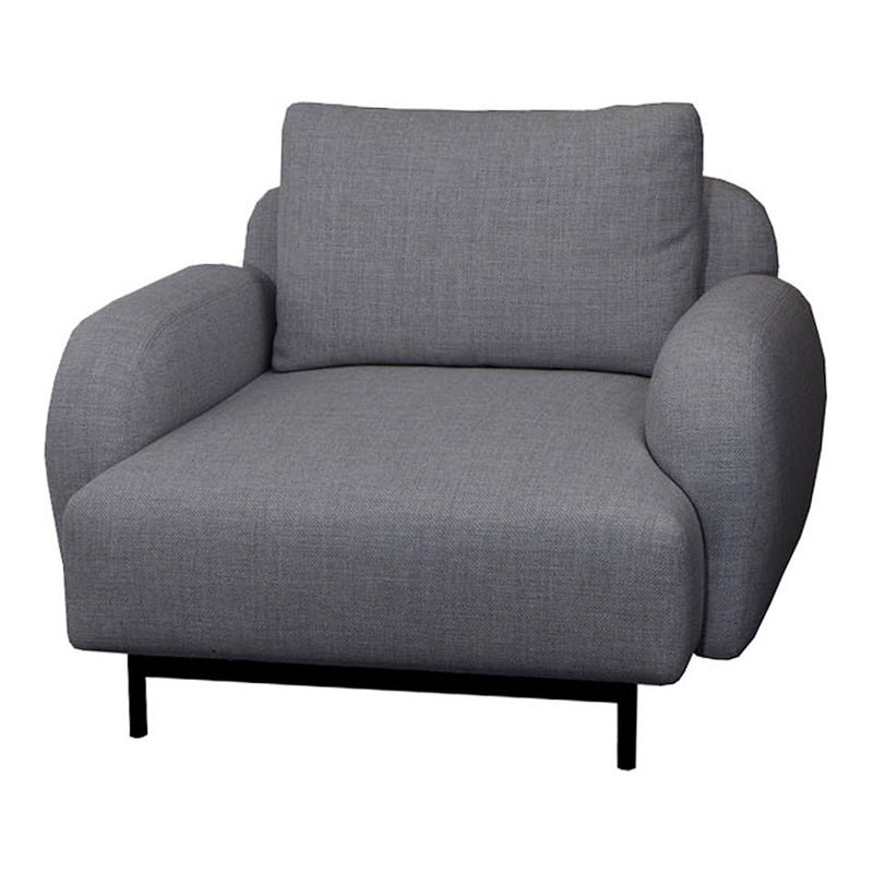 Gray upholstered armchair with a smooth texture and rounded armrests, set on a minimalist black metal frame.
