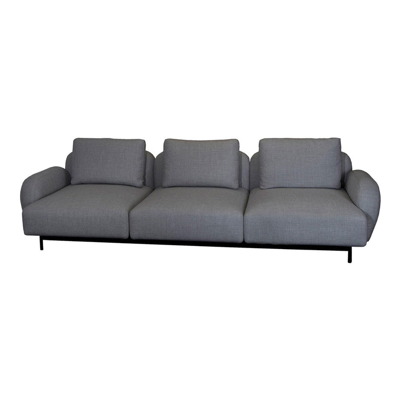 Gray upholstered sofa with smooth, subtle texture and clean lines, featuring three wide seats and a minimalist style.