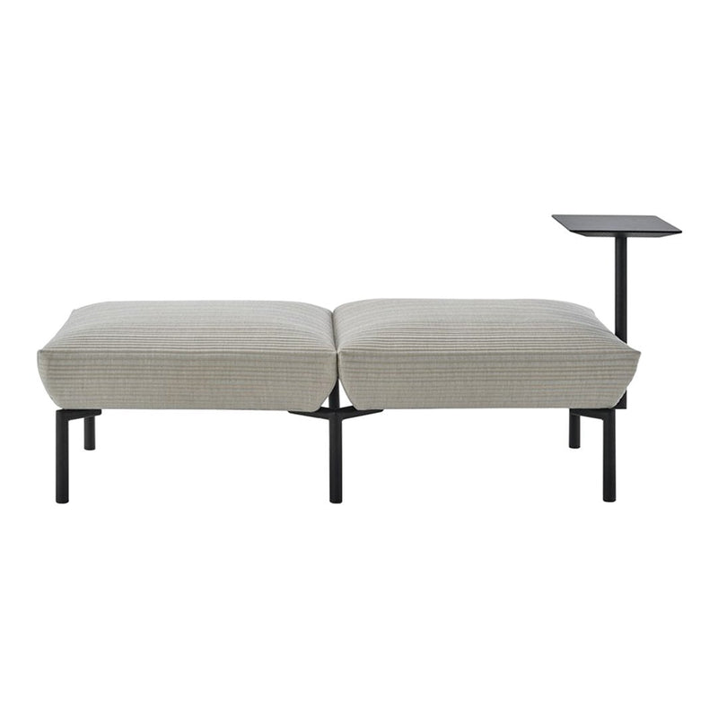 Neutral beige fabric with subtle texture, paired with sleek black metal legs and side table. Modern minimalist design.