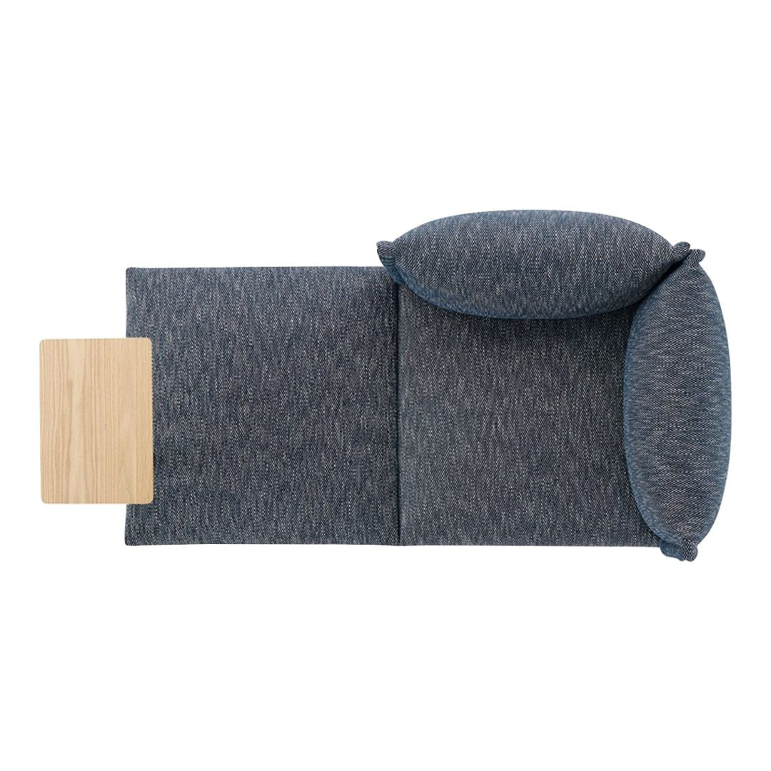 Textured dark blue upholstery with lighter blue accents and a natural wood side table. Modern and stylish design.