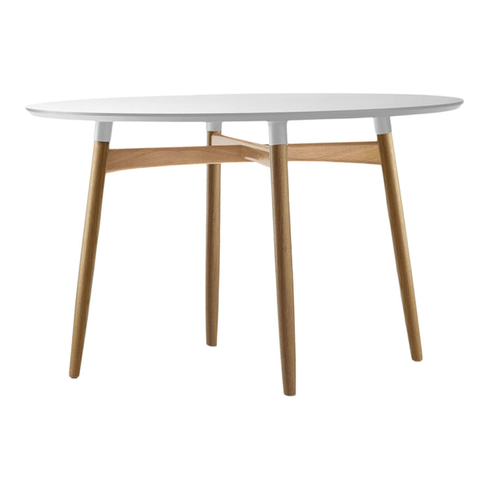 Modern round table with a white top and natural wood legs, showcasing a sleek, minimalist design.