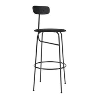 Black metal barstool with a simple, modern design and a sleek, minimalistic silhouette. Ideal for contemporary spaces.