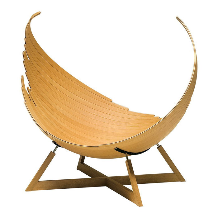 Natural wood-tone lounge chair with smooth, curved, slatted design and minimalistic geometric base in light tan color.