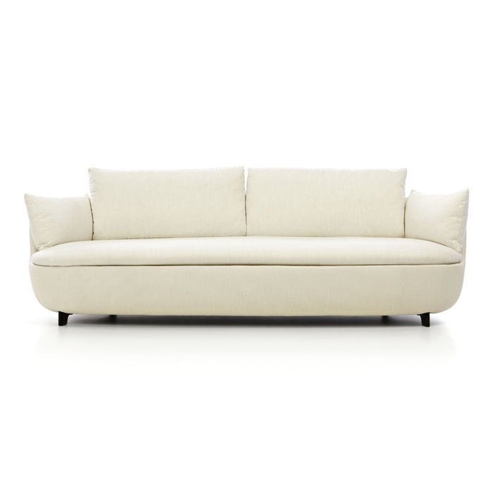 Modern cream-colored sofa with smooth, minimalist design and plush cushions, perfect for stylish interiors.