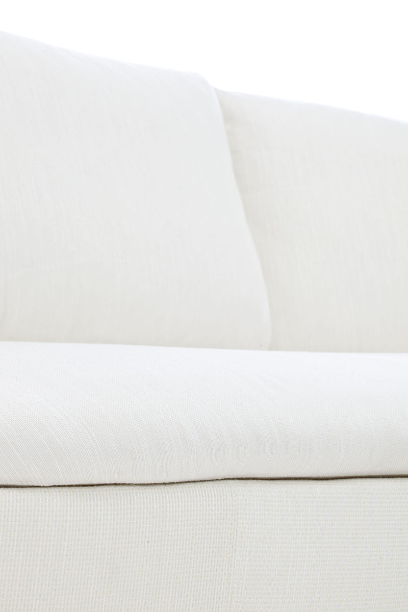Soft white sofa cushion with a smooth, textured fabric pattern, adding elegance to modern living spaces.
