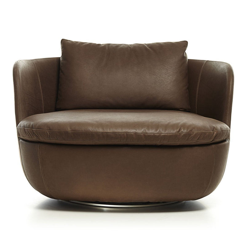 Brown leather accent chair with a smooth, rounded design and plush cushions, perfect for modern decor.