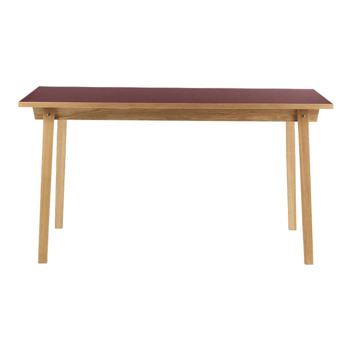 Rectangular table with a rich burgundy top and natural wood legs, showcasing a sleek and minimalist design.