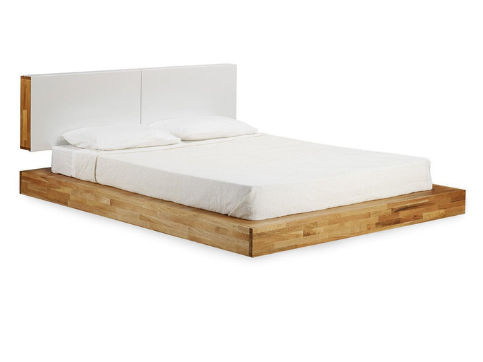 Modern white bed with a sleek design and light wood accents, featuring a minimalist style and neutral color palette.