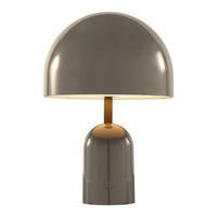 Modern gray table lamp with a glossy finish and a sleek bronze stem. Stylish, minimalist design for any decor.