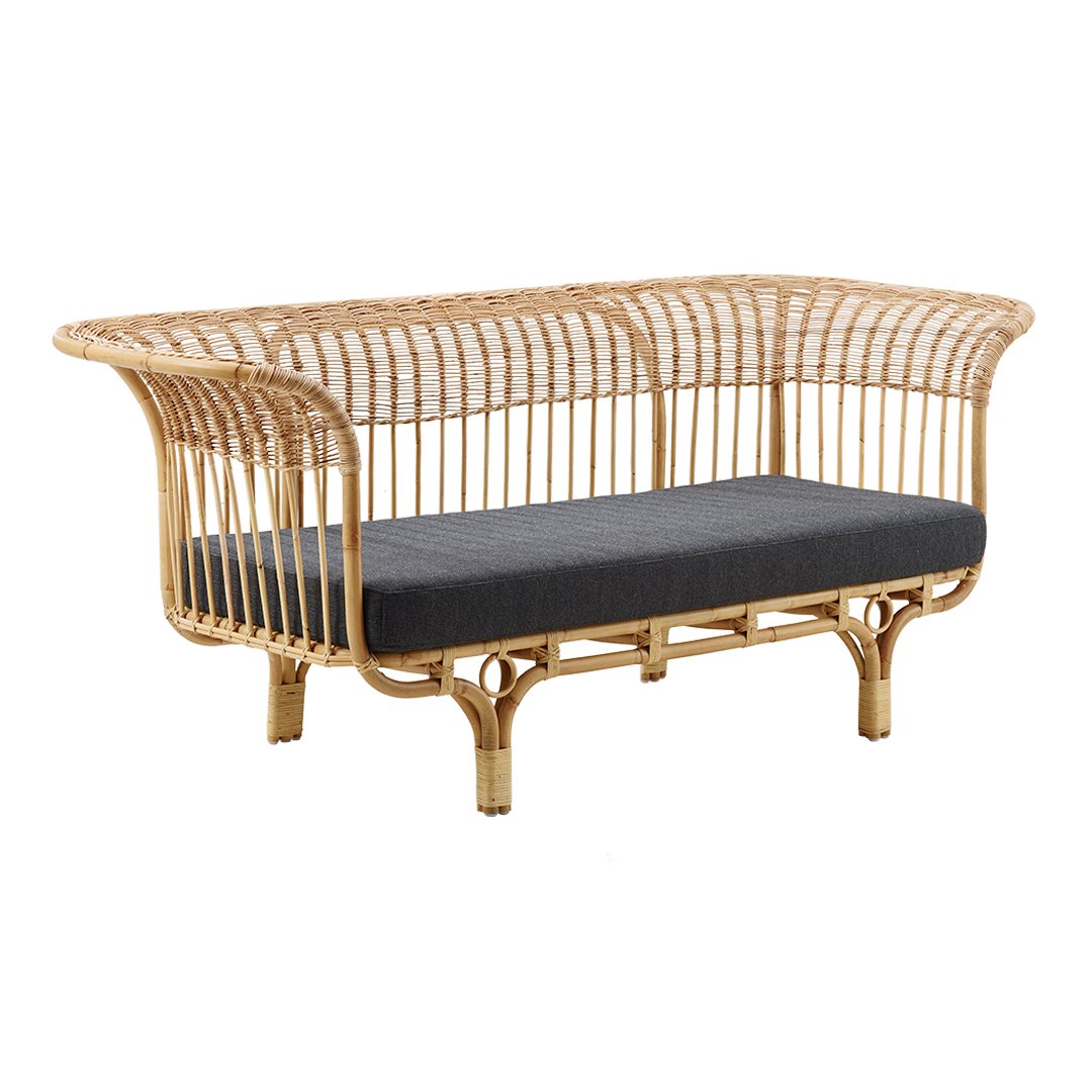Rattan sofa with natural bamboo finish and a dark gray cushion, featuring a sleek, woven pattern.