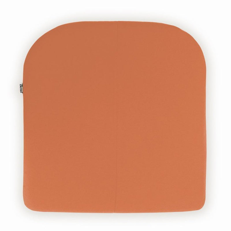 Orange ergonomic cushion with a smooth, rounded design for comfort and style.