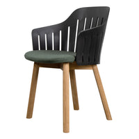 Stylish black chair with slatted backrest and green padded seat, complemented by natural wood legs.