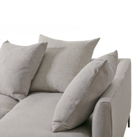 Light gray sofa with textured fabric and plush, varied gray cushions, designed for contemporary living spaces.