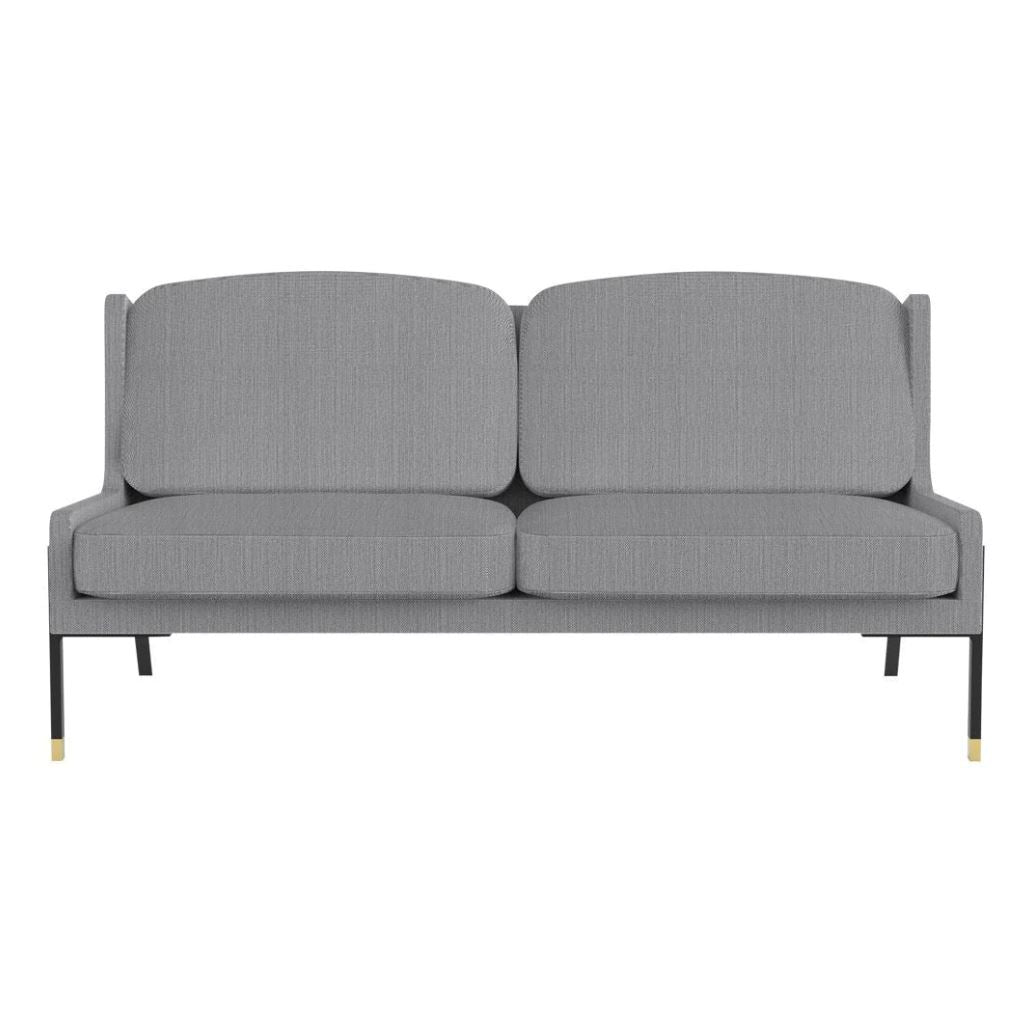 Gray fabric sofa with subtle textured pattern and black metal legs accented with gold details, perfect for modern decor.