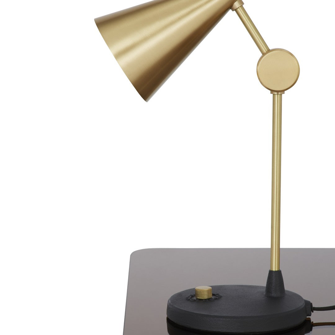 "Brass and black adjustable desk lamp with sleek, modern design."