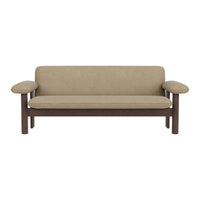 Beige upholstered sofa with a sleek, minimalist design and dark wood armrests for a modern touch.