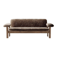 Cozy brown sofa with a textured fabric and light wood frame, perfect for a modern living space.