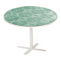 Round table with a mint green patterned top and a sleek white base. Ideal for modern decor.