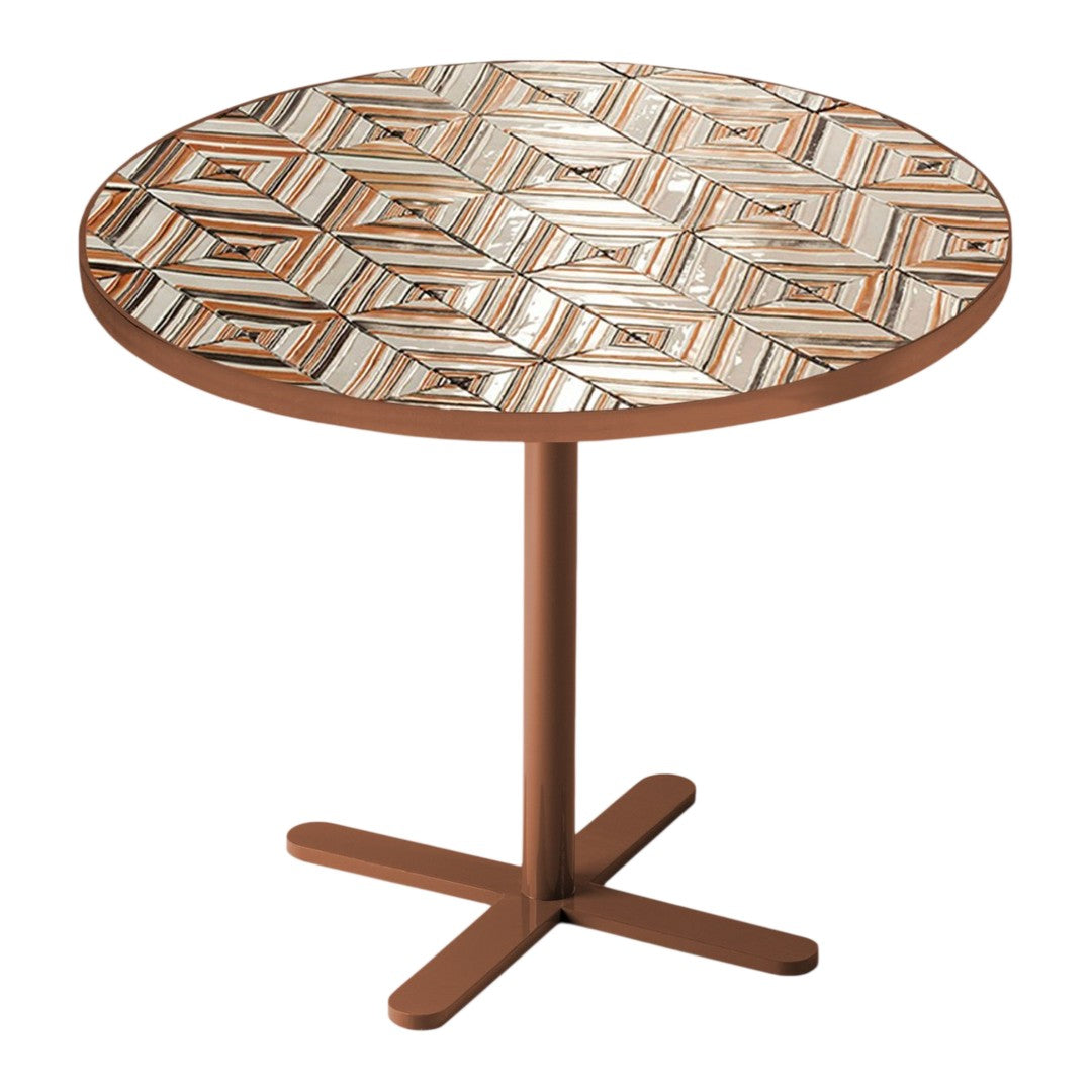 Round table with a geometric diamond pattern in browns, creams, and muted earth tones on a simple brown base.