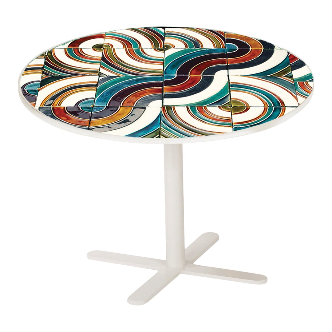 Round table with colorful abstract patterns in teal, orange, and white swirling designs. Modern and vibrant decor.