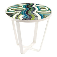 Round table with a vibrant green, blue, and white swirling pattern on a glossy surface and sleek white legs.