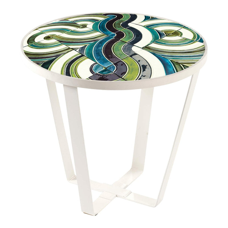 Round table with a vibrant green, blue, and white swirling pattern on a glossy surface and sleek white legs.