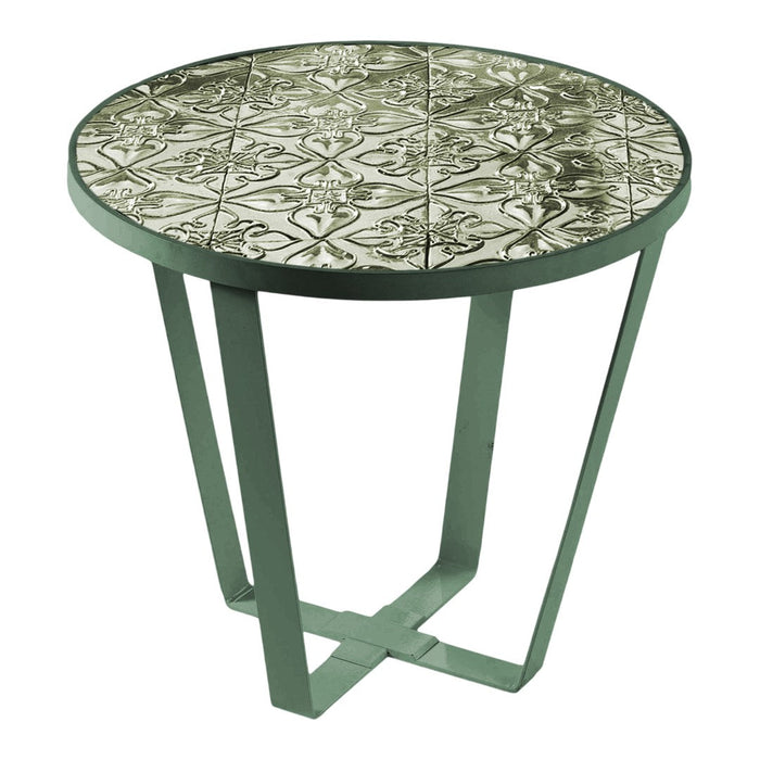Round table with an intricate black and white patterned top and a sleek green metal base. Perfect for modern decor.