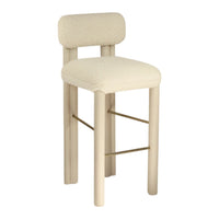 Cream-colored bar stool with a soft, textured fabric and minimalistic wood frame, featuring subtle gold accents.