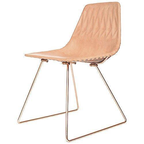 Light tan upholstered chair with a quilted pattern and sleek metallic legs. Modern design for stylish interiors.