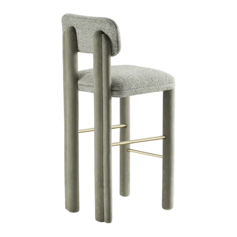 Gray upholstered bar stool with rounded backrest and gold accent, featuring a minimalist design and smooth texture.