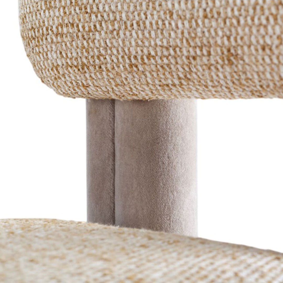 Beige woven fabric with a textured finish on a light gray chair leg. Perfect for modern, minimalist decor.