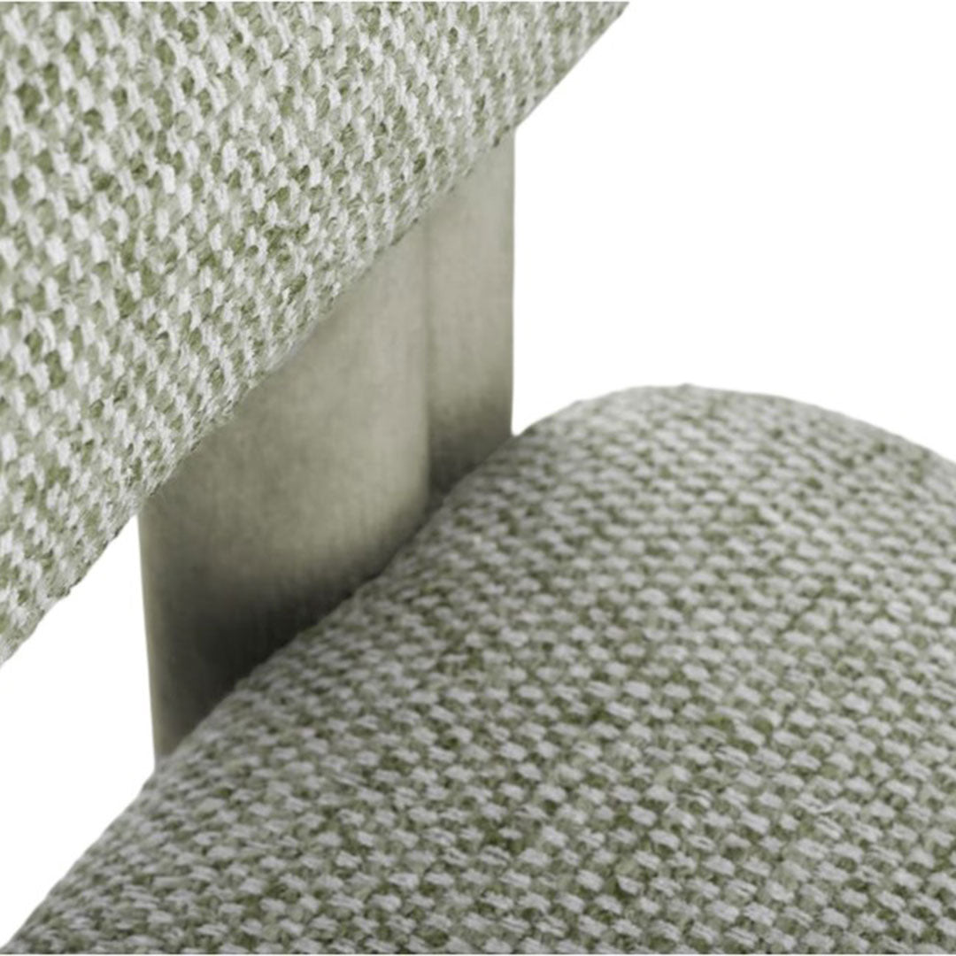 Textured green upholstery with a subtle pattern, featuring a sleek metallic frame. Ideal for modern interiors.