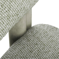 Textured green upholstery with a subtle pattern, featuring a sleek metallic frame. Ideal for modern interiors.