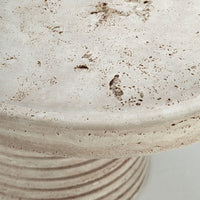 Textured beige surface with speckled patterns and subtle earthy tones, ideal for modern decor.