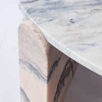 Elegant marble table featuring soft white and beige hues with striking gray veining patterns. Perfect for modern decor.