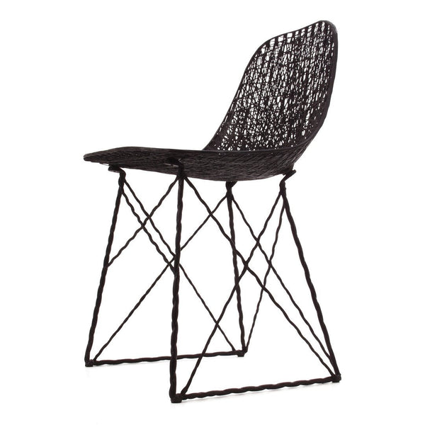 Black woven chair with a geometric pattern and slender black metal legs. Stylish and modern design for any space.