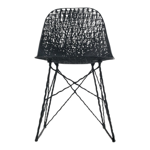 Black woven chair with a textured pattern and slender cross-legged base. Ideal for modern decor.