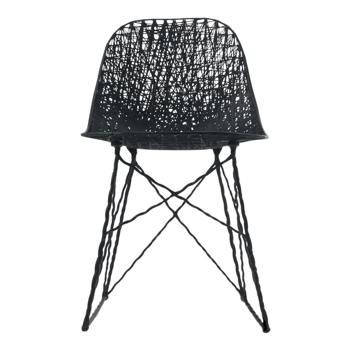 Black woven chair with a textured pattern and slender cross-legged base. Ideal for modern decor.