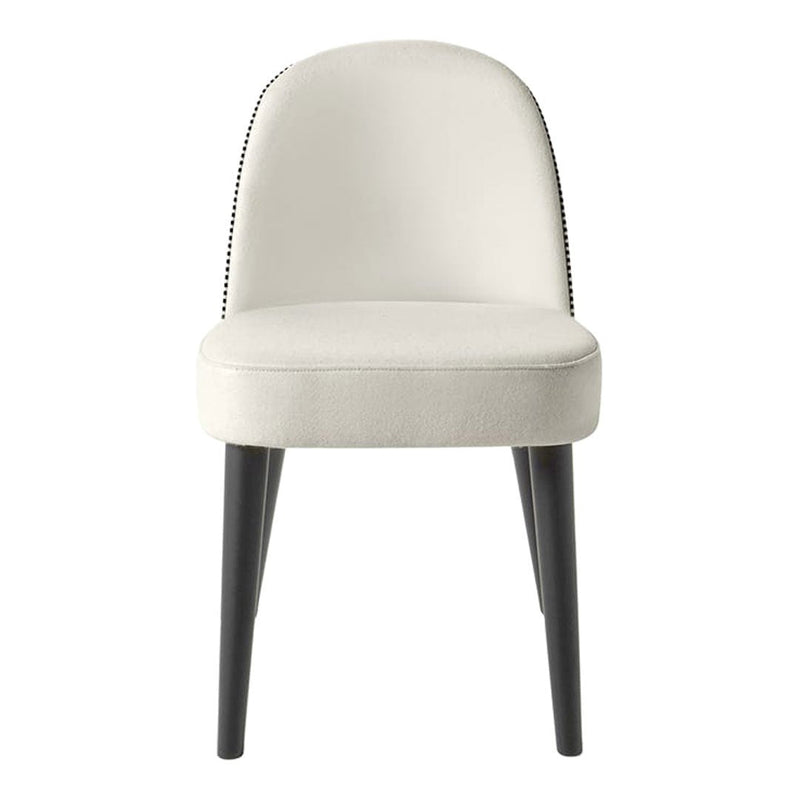 Elegant cream chair with subtle black nailhead trim and sleek black legs, perfect for modern decor.