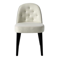 Cream tufted chair with black wooden legs and silver nailhead trim, featuring a smooth, contemporary design.
