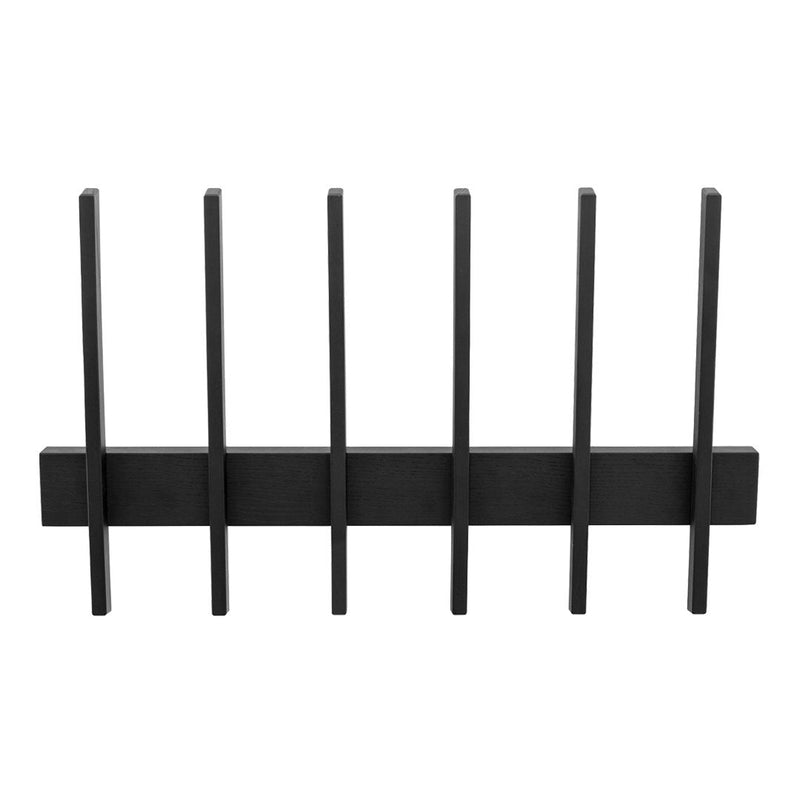 Black metal wall rack with minimalistic design and sleek vertical slats. Ideal for modern decor.