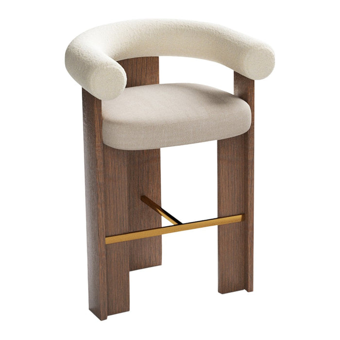 Curved cream upholstery with a warm wood base and gold accent, perfect for modern decor.