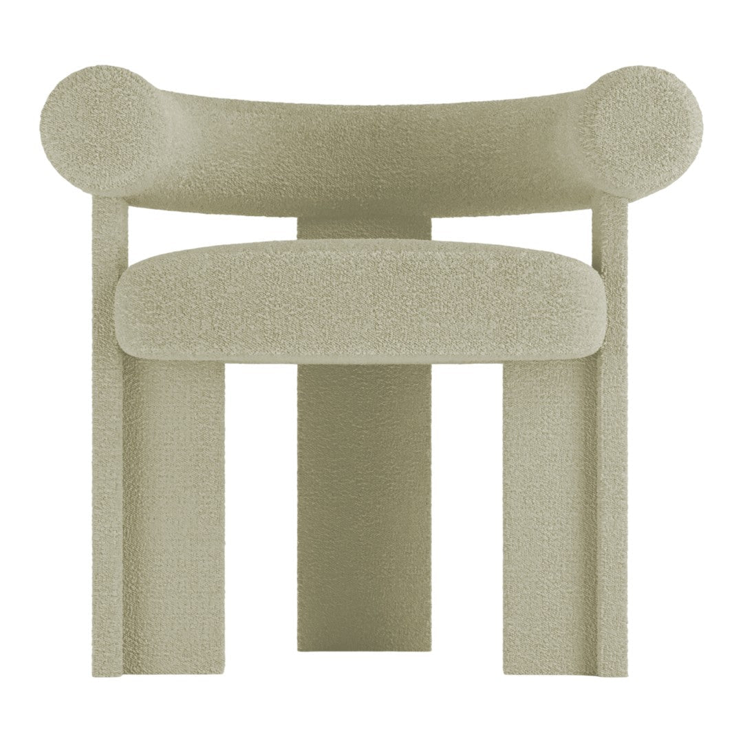 Textured light green chair with rounded edges and a minimalist design. Contemporary style with a soft, neutral palette.
