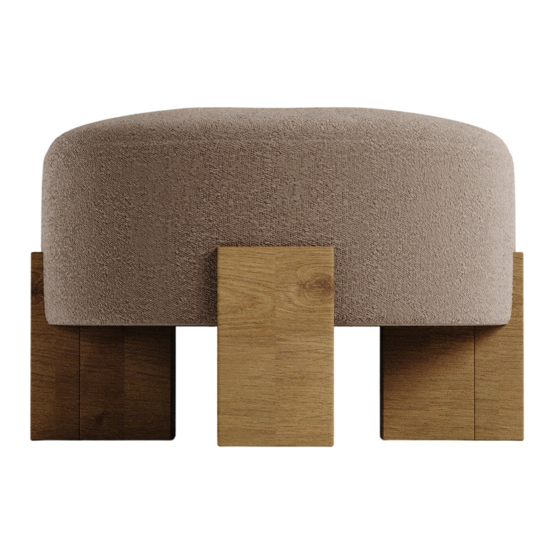 Beige upholstered ottoman with wood block legs, featuring a sleek, minimalist design. Perfect for modern decor.
