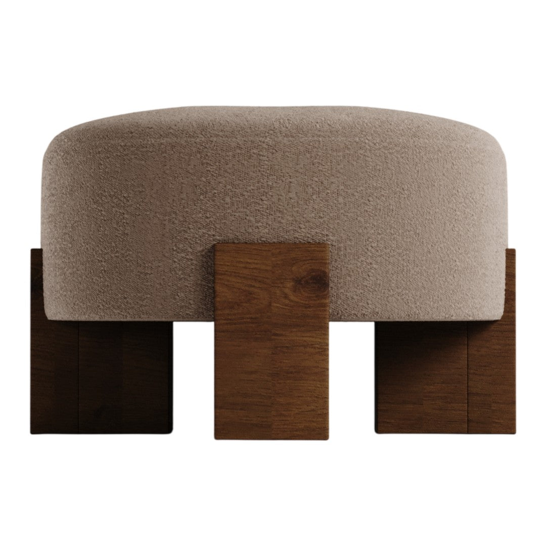 Round beige pouf with textured fabric, featuring wooden legs in a rich brown finish. Modern, minimalist design.